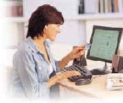 Photo of a woman sitting at a computer